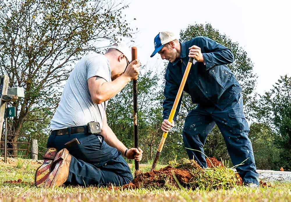 DSC05523 Two Davis Services workers digging