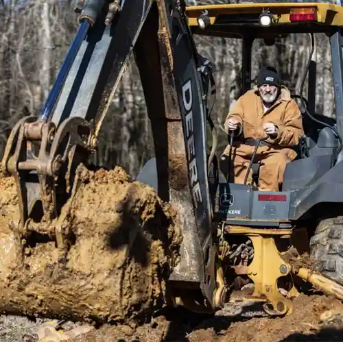 man digging hole