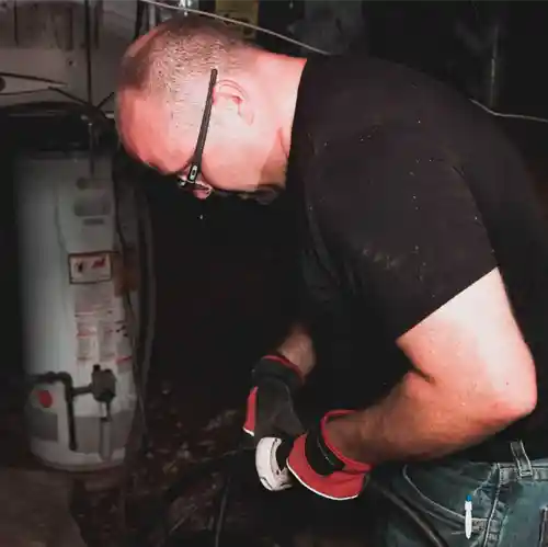 Man working on plumbing
