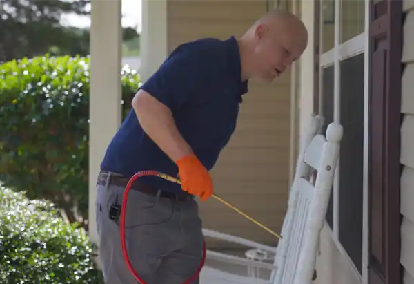 Man spraying pest controlling chemicals